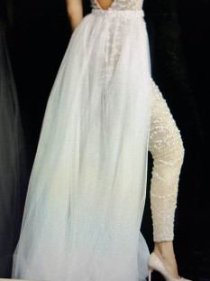  Beaded jumpsuit, with a deep V in the back, comes with detachable sheer tulle overskirt.