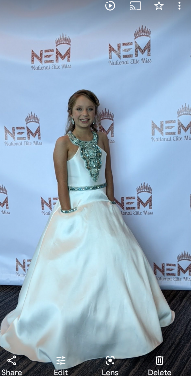 White little miss formal wear with beaded top and back.